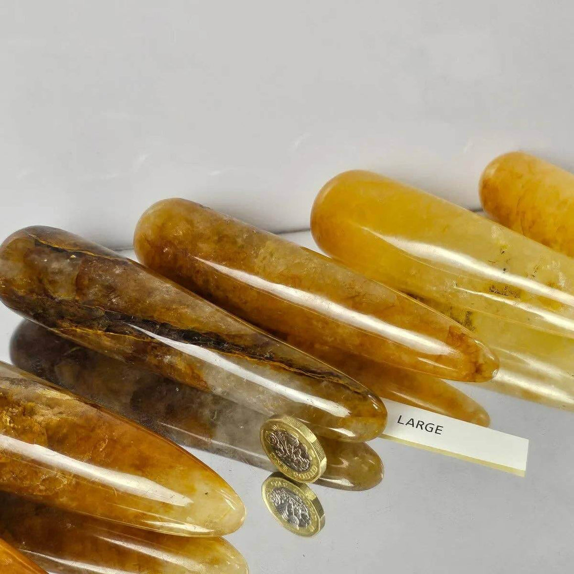 Set of amber-colored hair clips on a white background