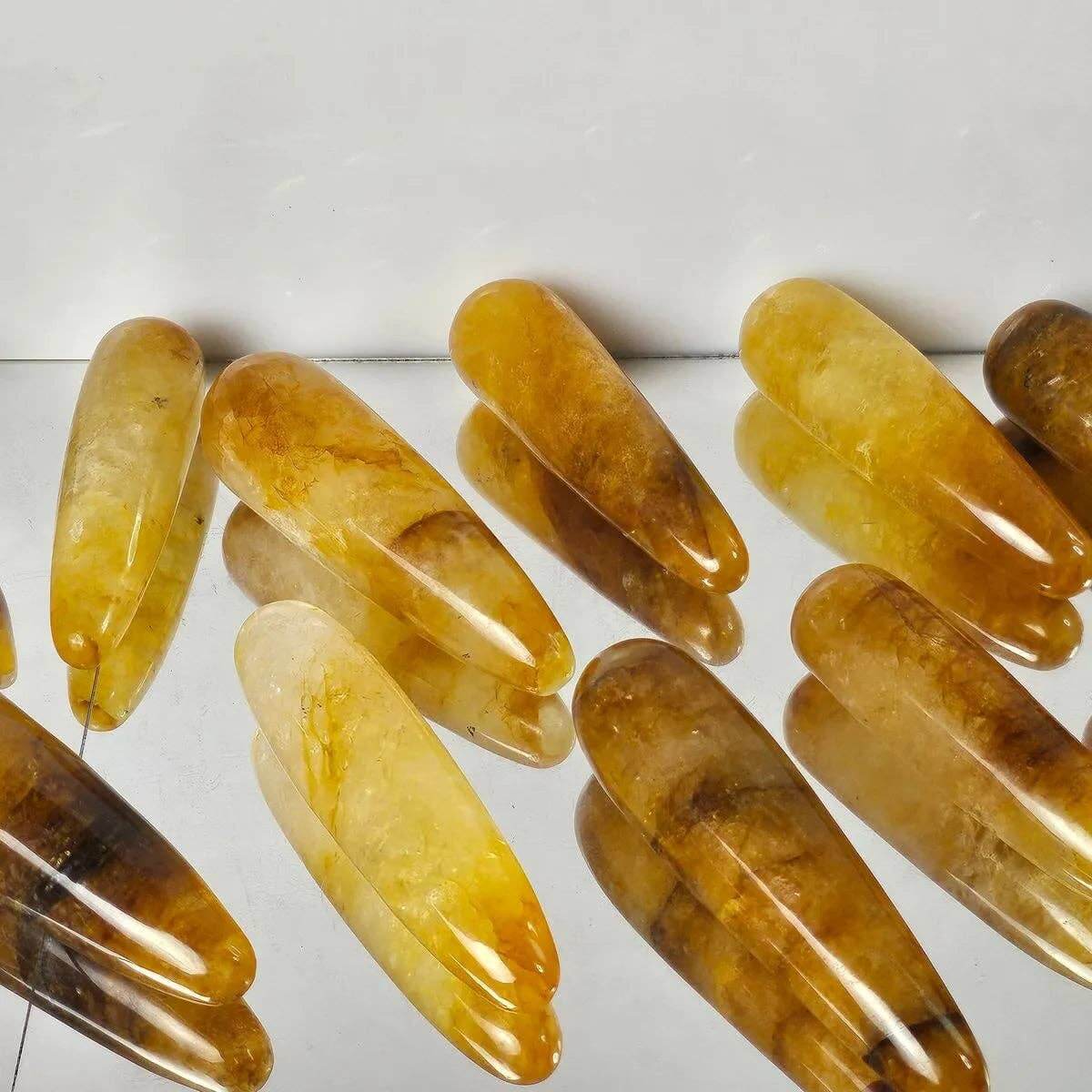Set of amber-colored hair clips on a white background