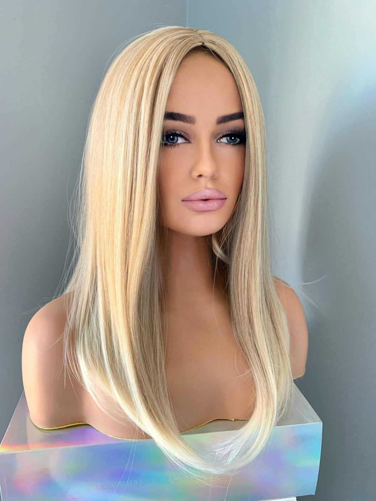 Blonde Wig displayed on a mannequin, showcasing silky straight style and medium golden blonde color.