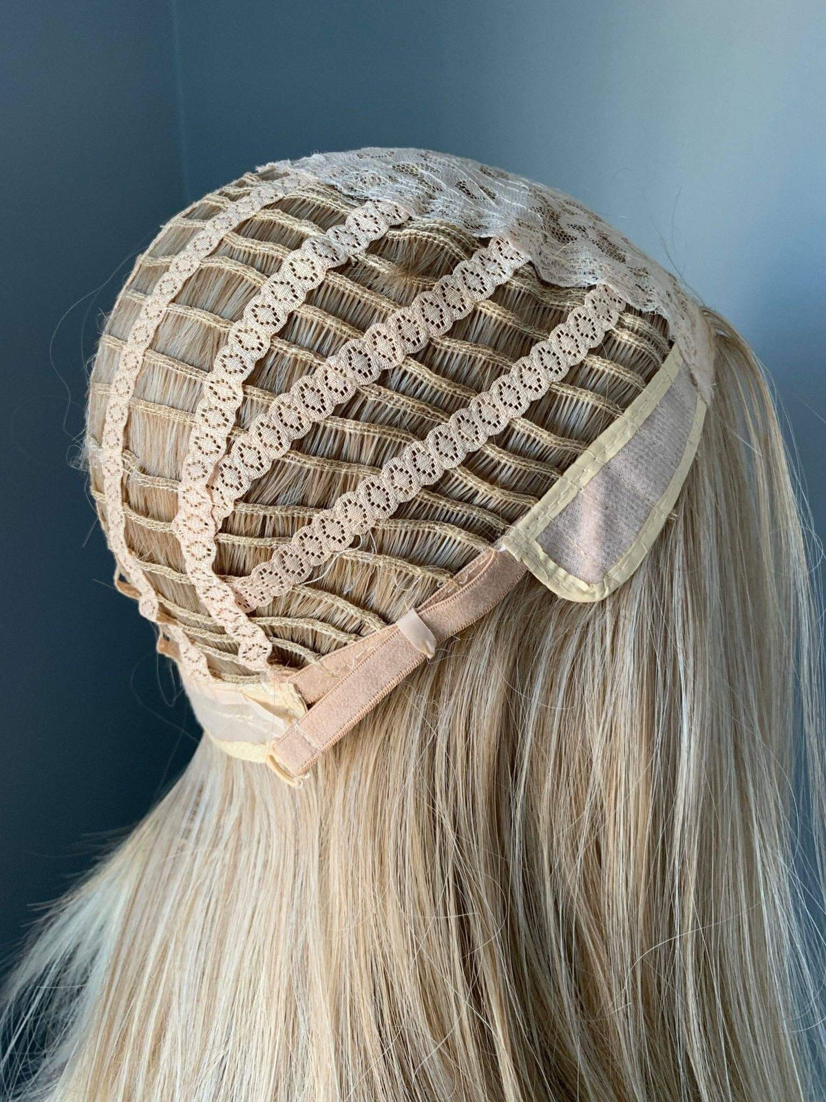Blonde Wig cap construction showcasing lace and adjustable straps for a secure fit on the Hailey Silky Straight Blonde Wig.