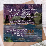 Hand In Hand Wedding / Anniversary Card featuring otters beneath a crescent moon with heartfelt verse.