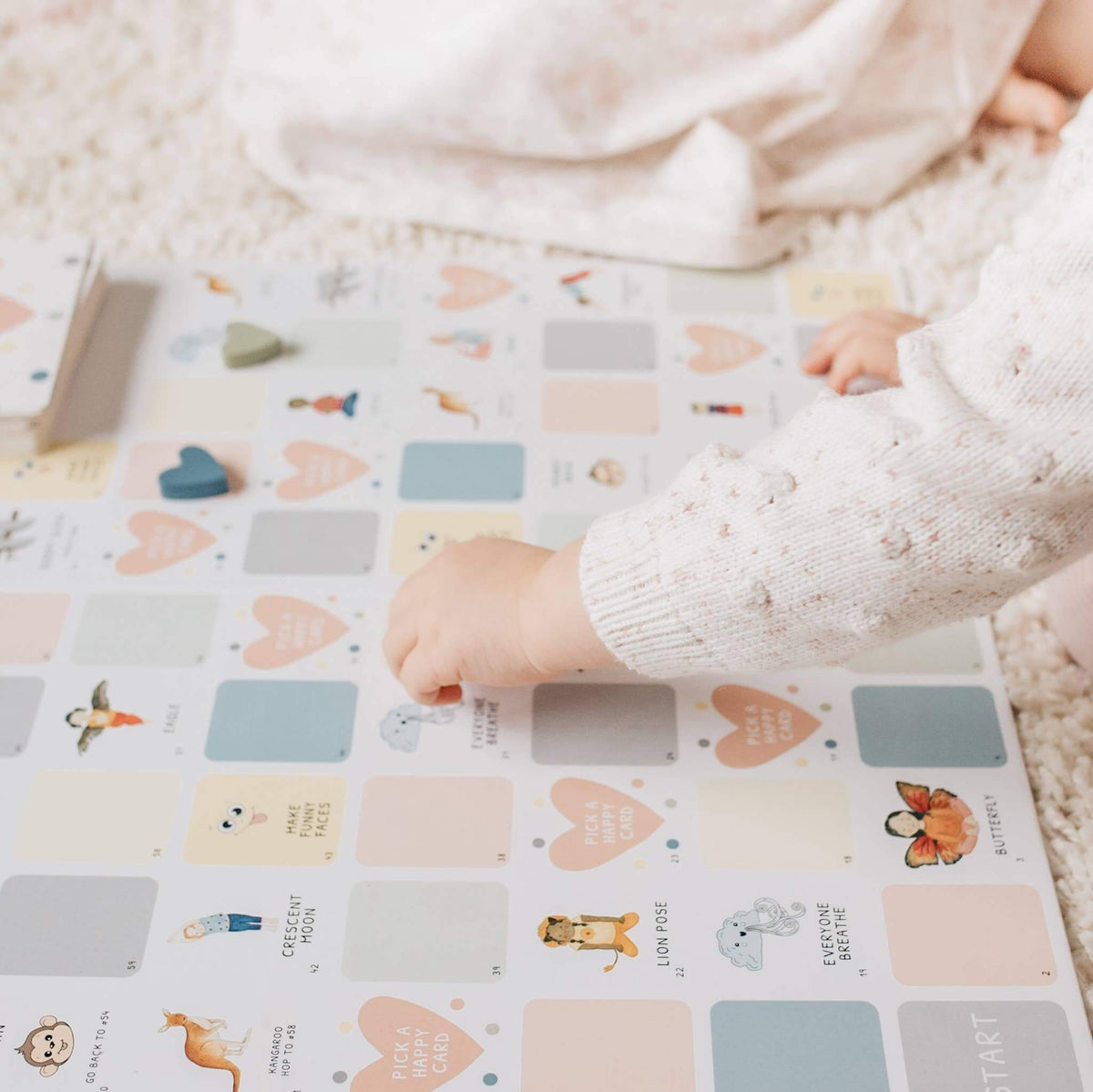 Children's play mat with colorful designs on a soft surface