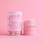 Pink skincare product with packaging on a pink background