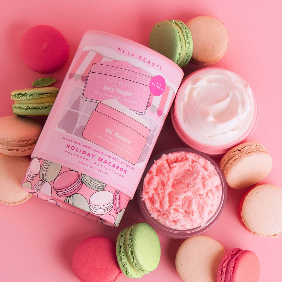 NCLA Beauty holiday macaron-themed product with pink and green macarons on a pink background