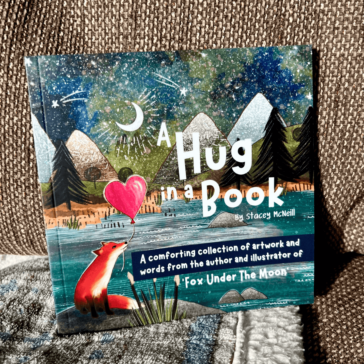 Hug In A Book mini book featuring artwork and words from Fox Under The Moon in a cozy setting.
