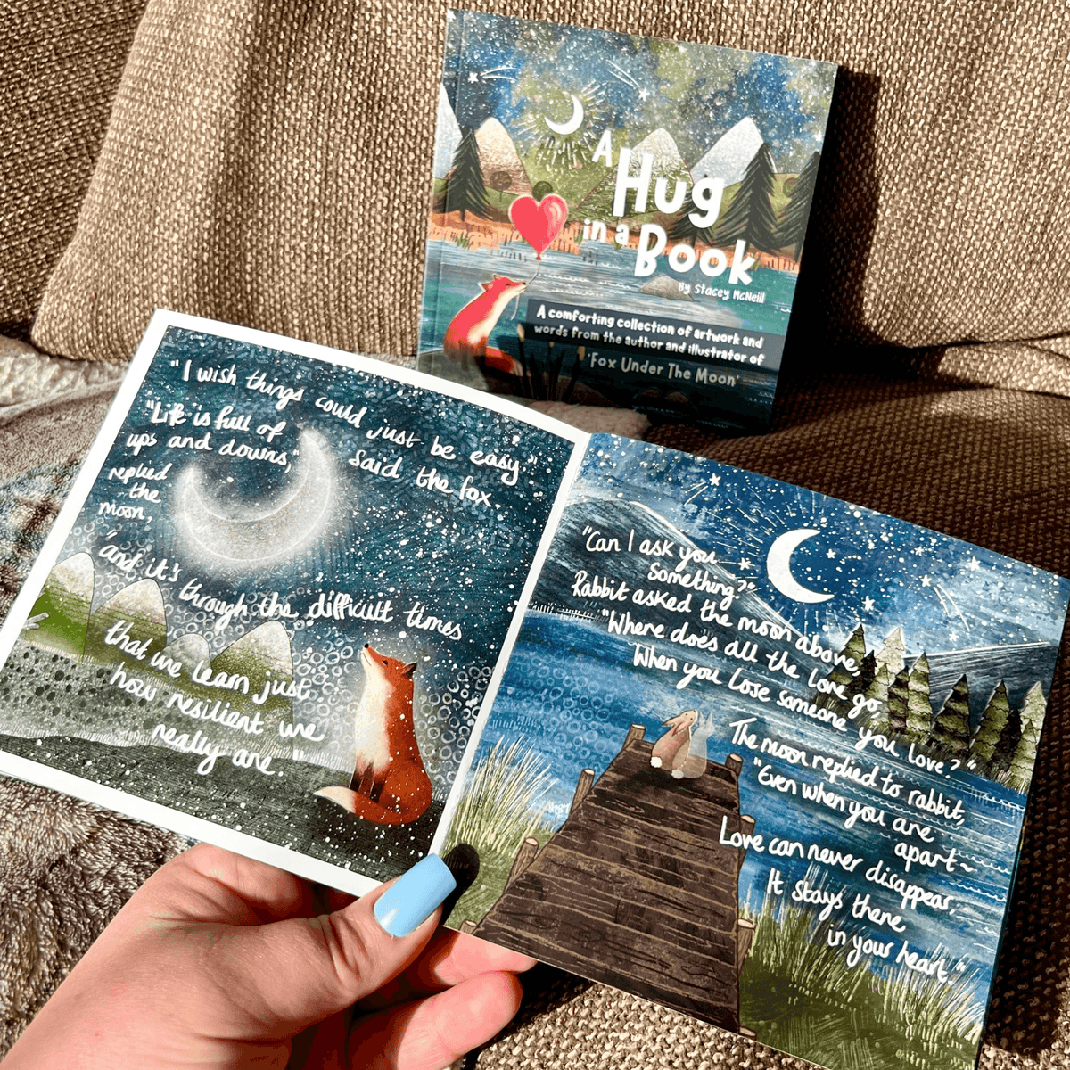 Hug In A Book mini book open to illustrations and inspirational quotes, perfect for gifting or personal motivation.