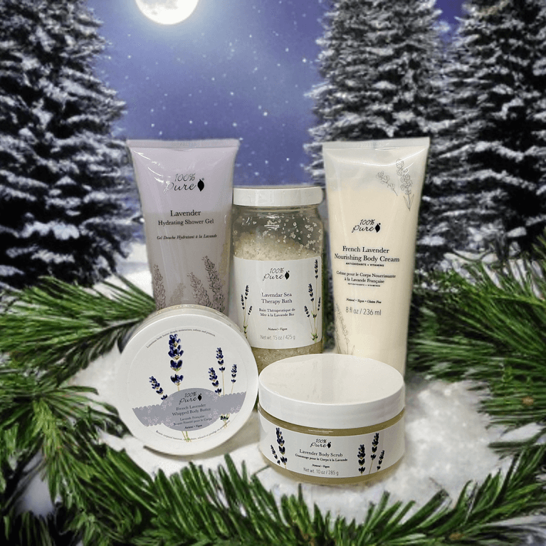 Luxury lavender bath set displayed with lavender shower gel, body cream, and scrub in a wintry setting.