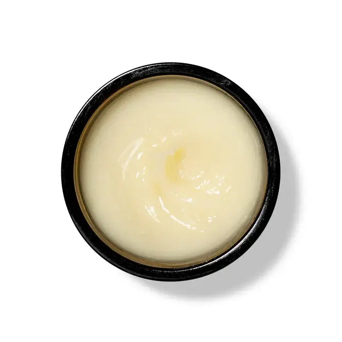 Intensive Nourishing Balm in a black container, ideal for soothing dry skin conditions like eczema and psoriasis.