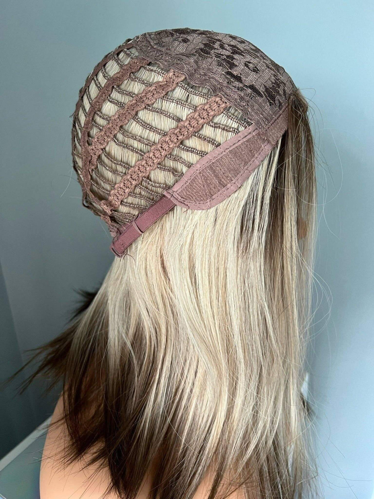 Interior view of the Jenna Short Rooted Blonde Wig with Low Lites cap construction showing breathable mesh and adjustable straps.
