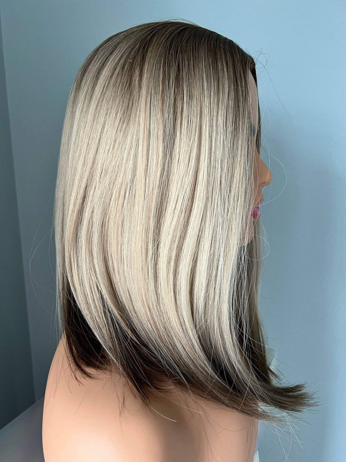 Jenna Short Rooted Blonde Wig with Low Lites showcasing sleek, modern layers and dimensional color details.