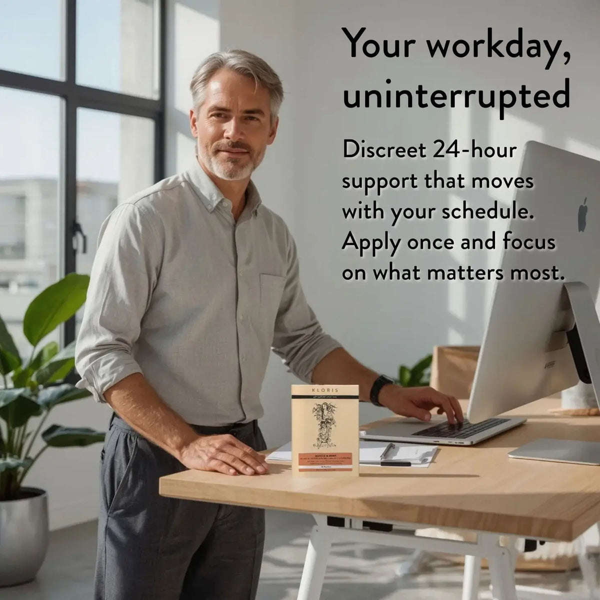 Man at a desk with a computer, with text about 24-hour support.