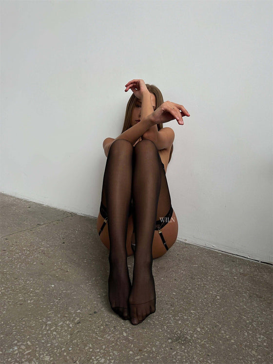 Lace Stockings in black, showcasing a sleek and elegant leg silhouette, ideal for enhancing lingerie looks.