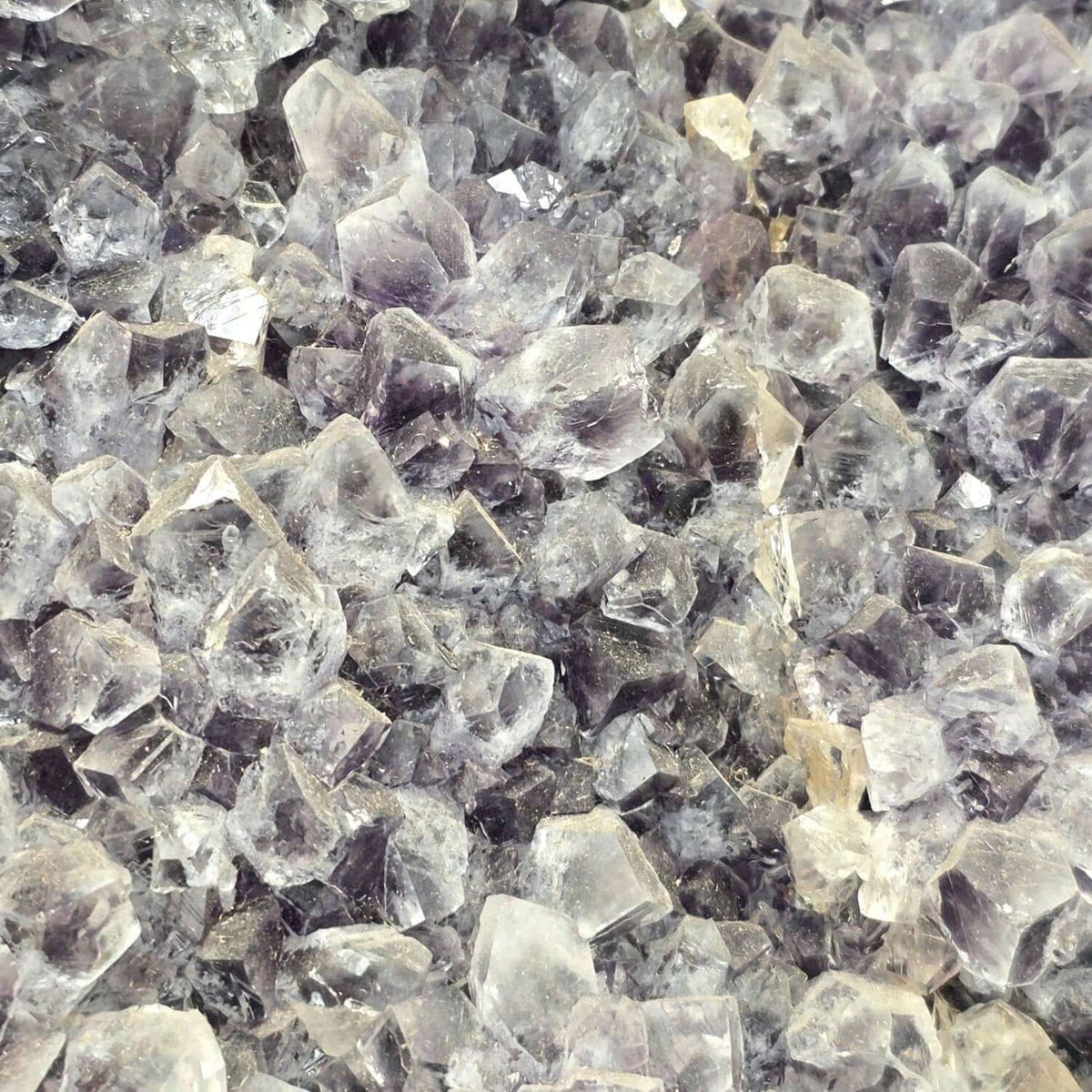 Close-up of raw amethyst crystals showcasing natural beauty for large amethyst crystal heart.