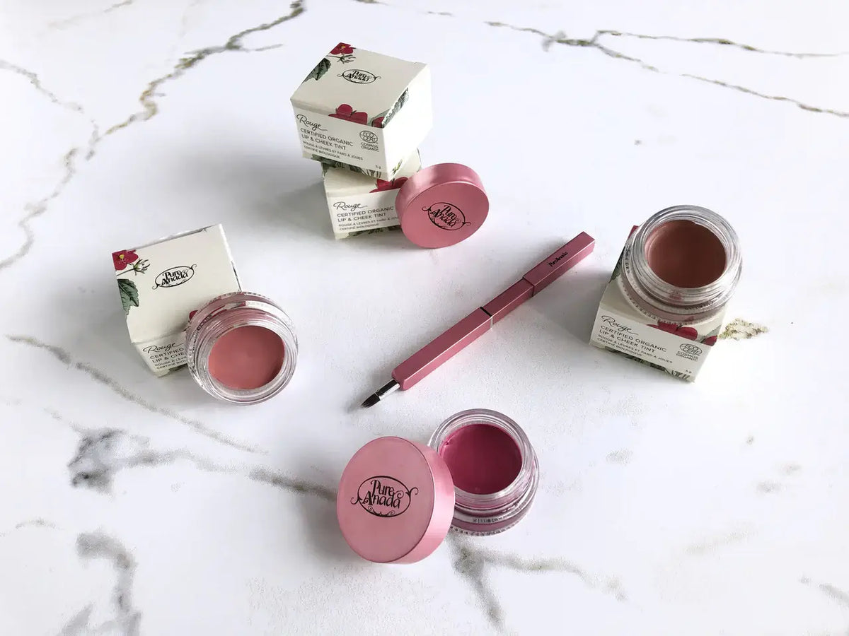 Maud Natural Lip & Cheek Rouge in jars with packaging and applicator on a marble surface - Cheek Rouge