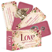 Love Affirmations Cards box with open cards displaying 'Empathy' and 'Curiosity' to enhance communication.