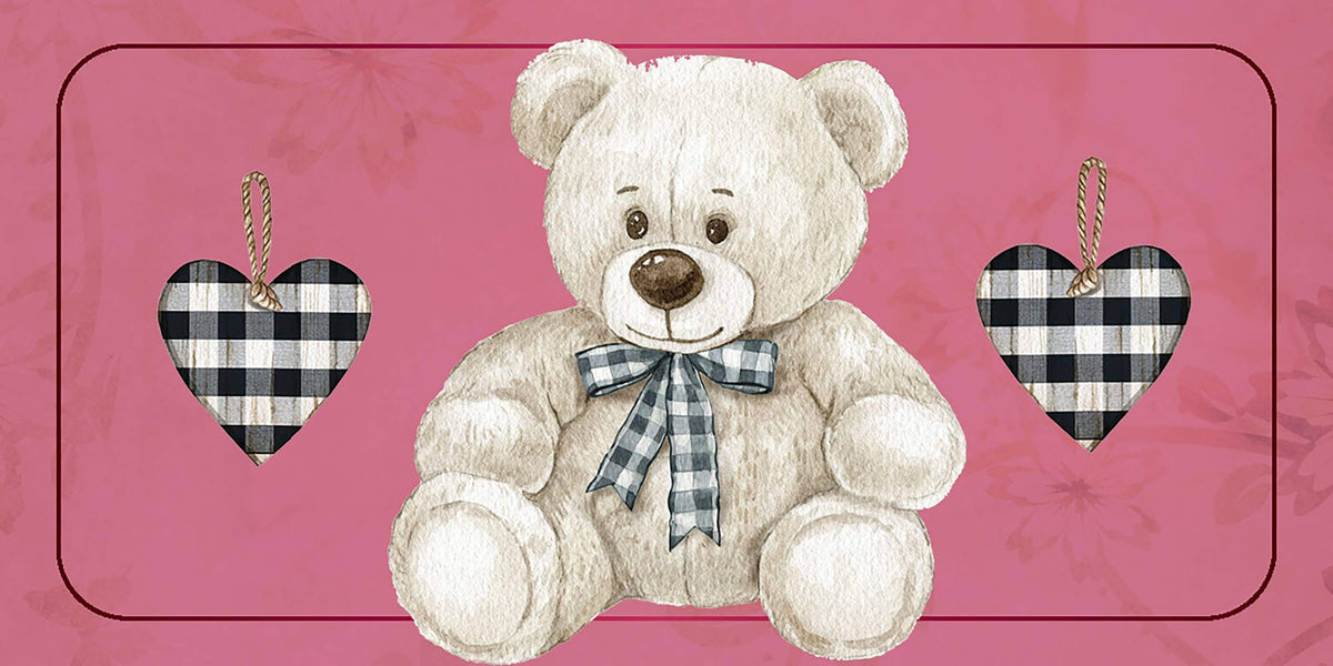 Cute teddy bear with a bow sitting between heart-shaped decorations on a pink background.