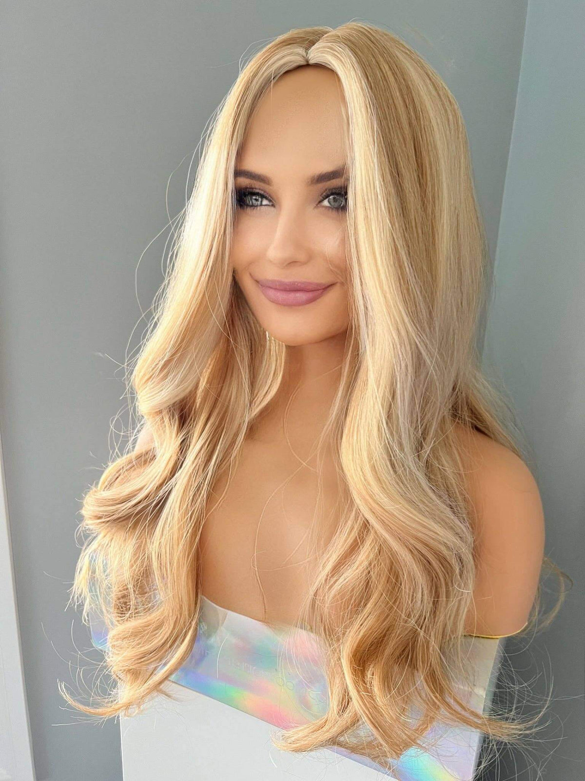 Madelyn Long Golden Blonde Curled Wig, featuring soft layers and flowing curls for a glamorous look.