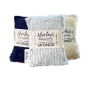 Three pairs of Marley's Monarchs washed and repiled sponge washcloths in navy blue, light blue-gray, and cream, bundled together with a paper band.