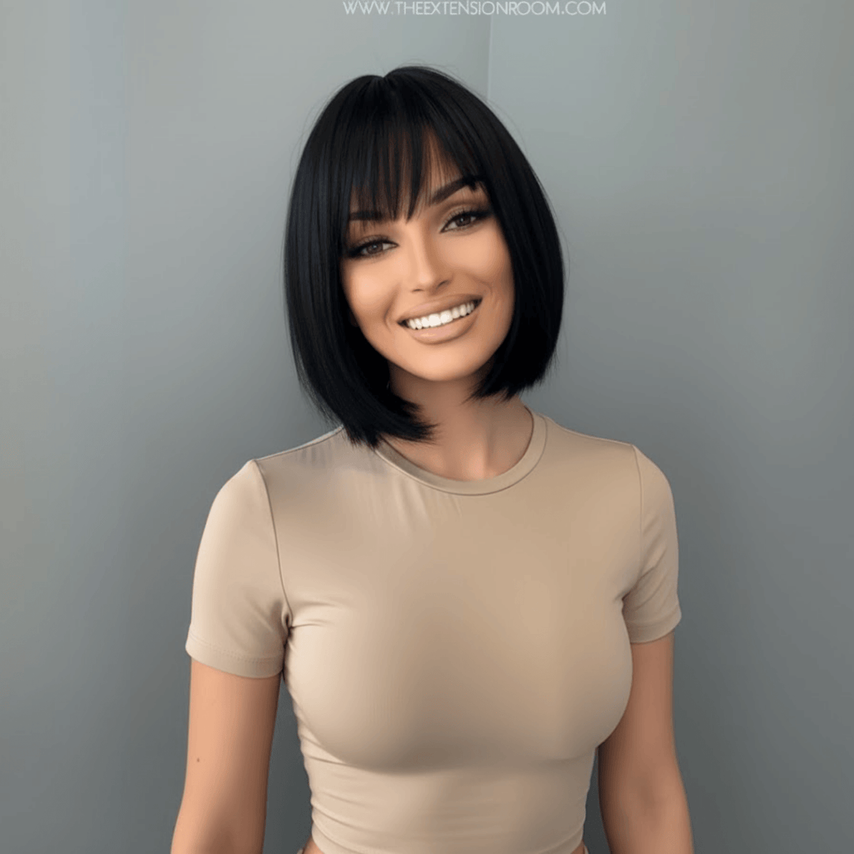 Woman with a stylish haircut against a plain background