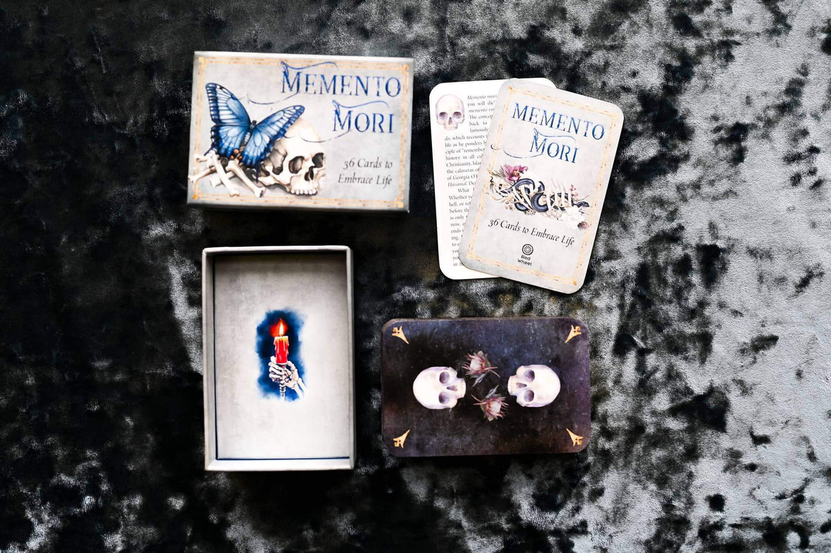 Memento Mori Cards featuring beautifully designed affirmation cards with skulls and butterfly on a dark velvet background.