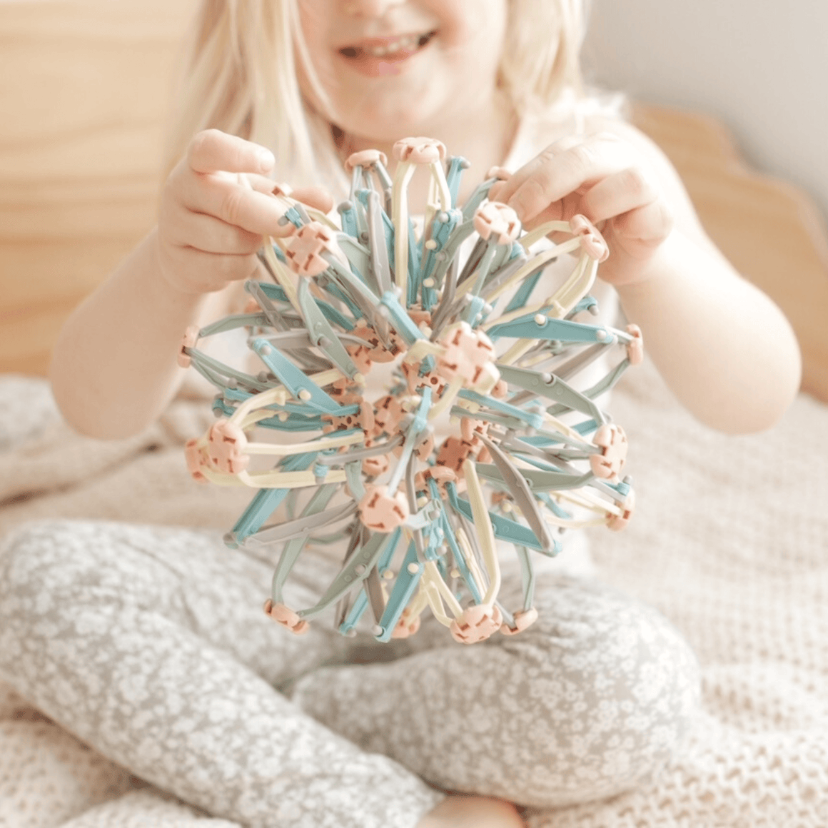 Child enjoying the Mindfulness Magic Ball, an interactive toy for mindful breathing and relaxation techniques.