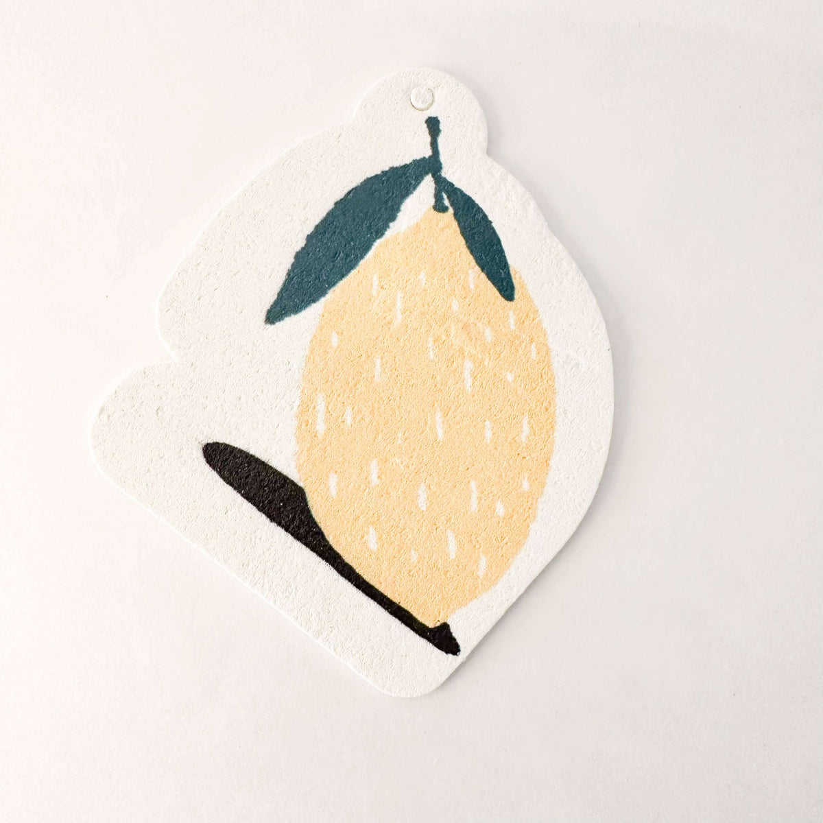 Decorative lemon-shaped sign with a yellow lemon illustration on a white background