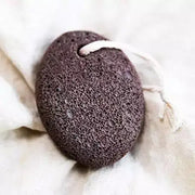 Brown textured sponge on a white fabric background