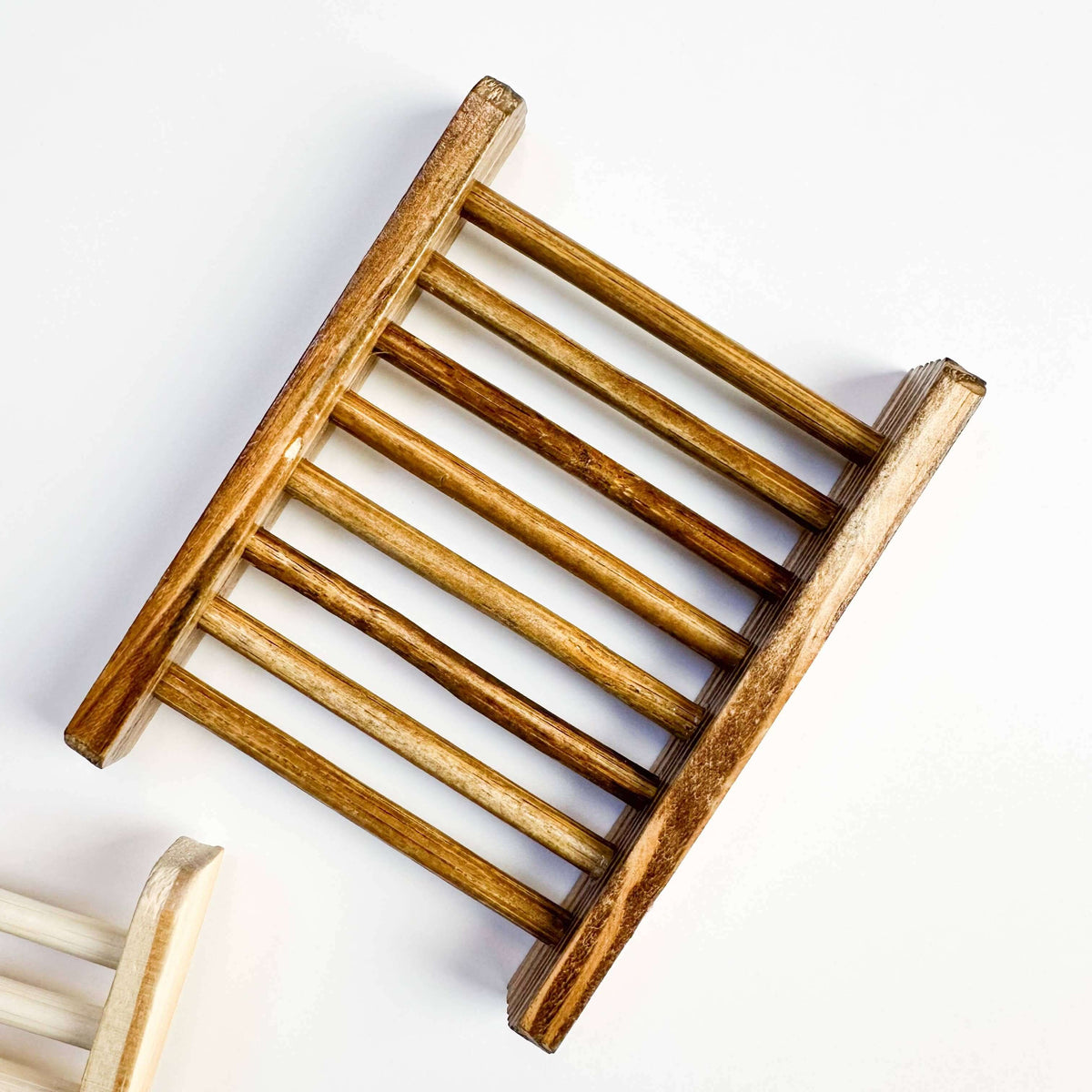 Wooden soap dish on a white background