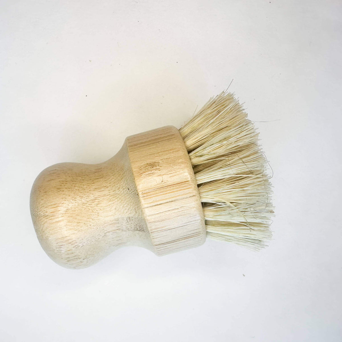 Wooden brush with bristle head on a white background