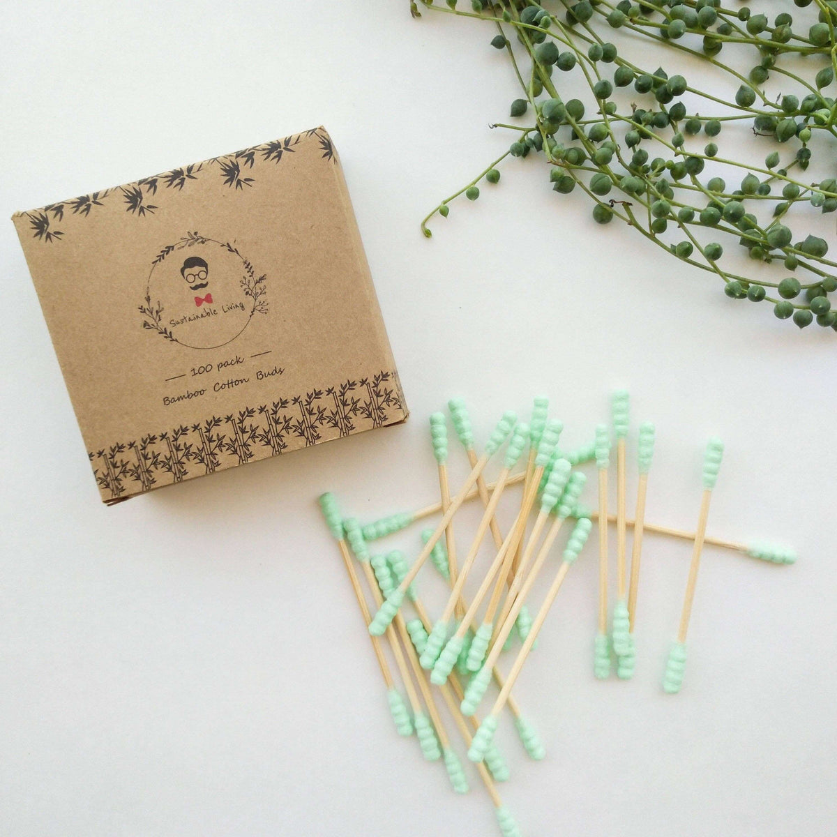 Box of Swabber King cotton buds with green cotton tips on a white surface.
