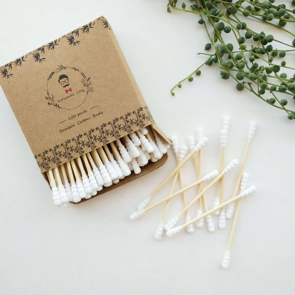 Brown paper packaging with cotton buds on a white background