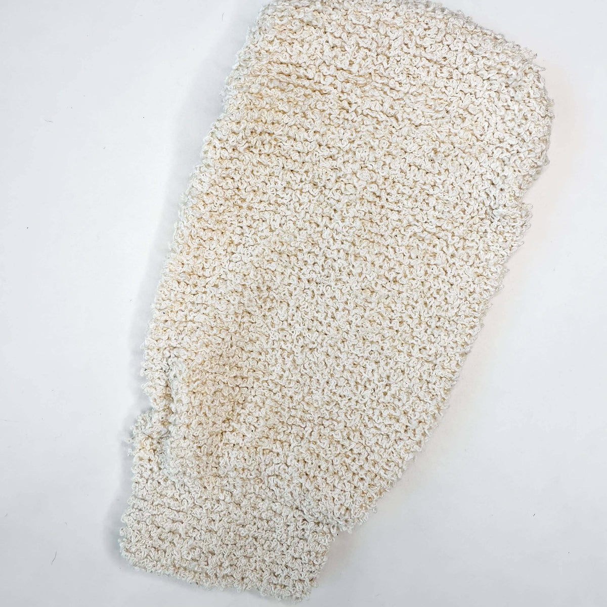 Textured white stone on a light gray background