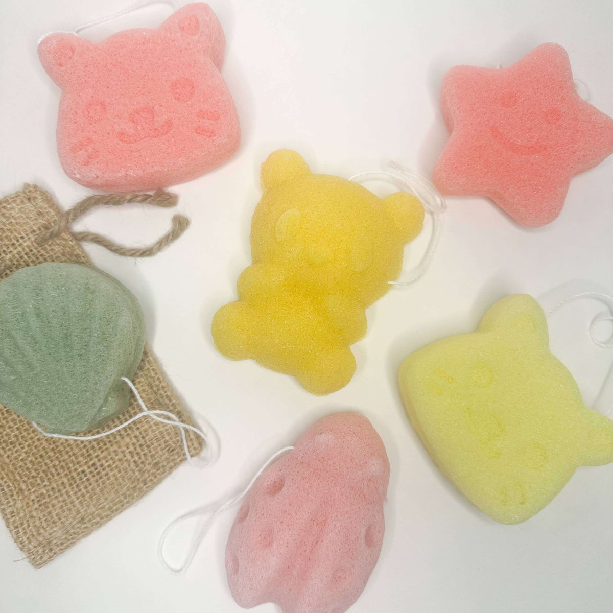 Natural Organic Konjac Facial Sponges in fun shapes, including bear, star, and animal designs for effective skincare.