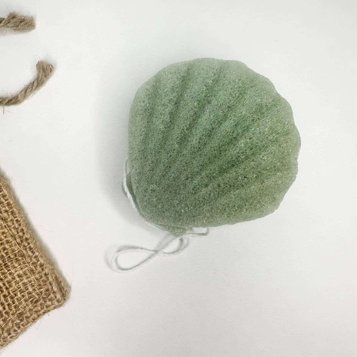 Natural Organic Konjac Facial Sponges – Eco-friendly biodegradable facial sponge in a shell shape.