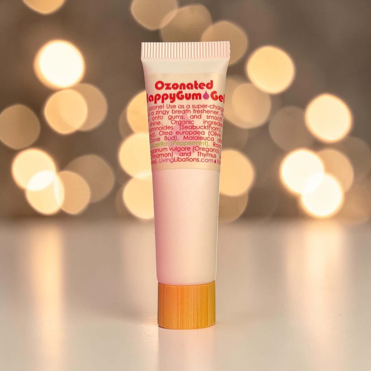 Tube of Ozonated HappyGum Gel with a blurred lights background