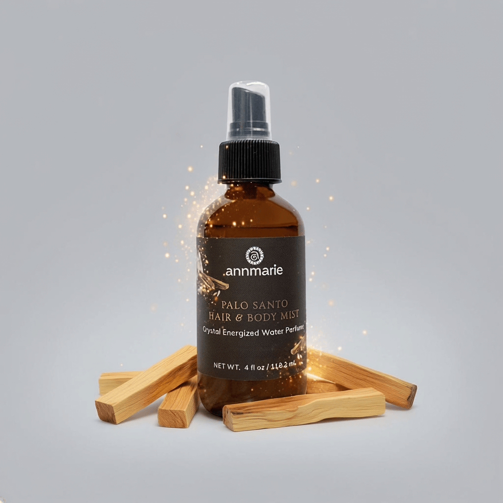 Brown bottle of 'annmarie' Palo Santo Hair & Body Mist with wooden sticks on a gray background