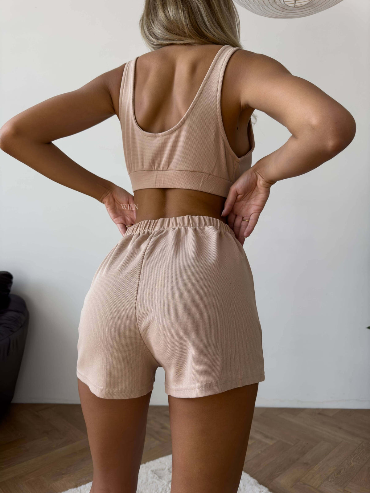 Rear view of a model wearing the PEACE Three-Piece Lounge Set in Mocha Latte, showcasing soft fabric and relaxed fit.