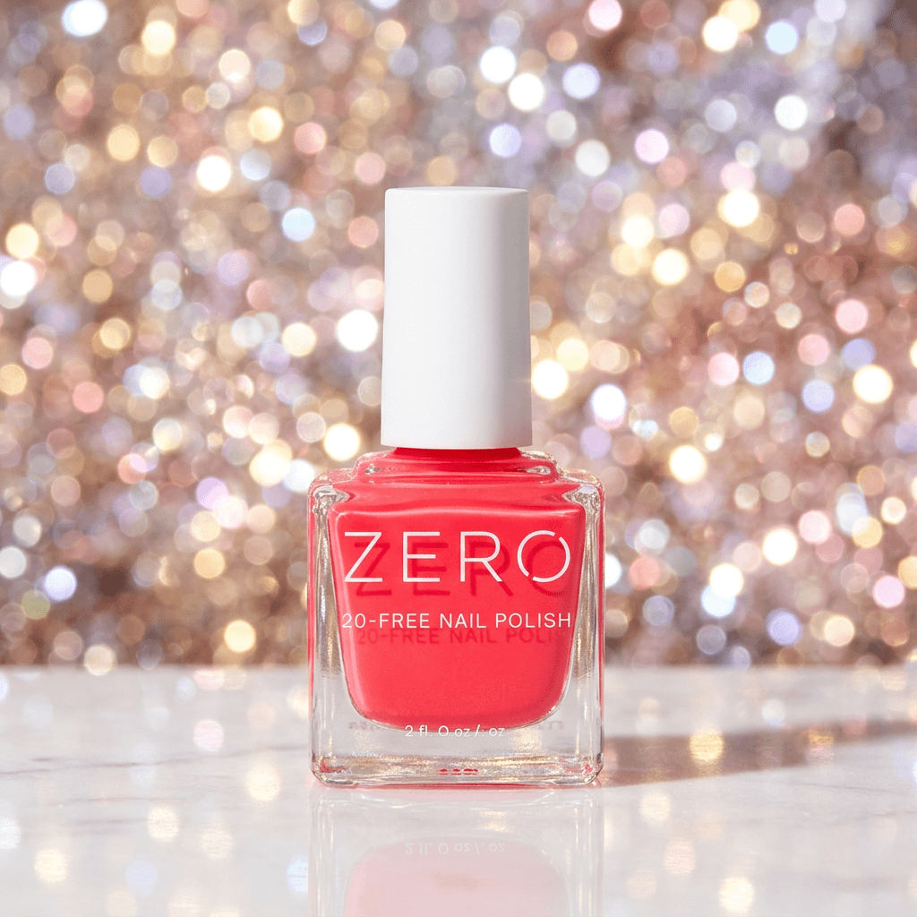 Pink nail polish bottle labeled 'ZERO' against a sparkling background
