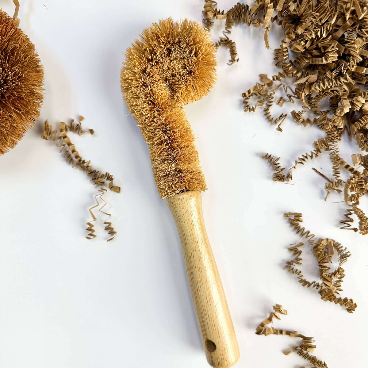 Bamboo bottle brush with natural bristles on a white background