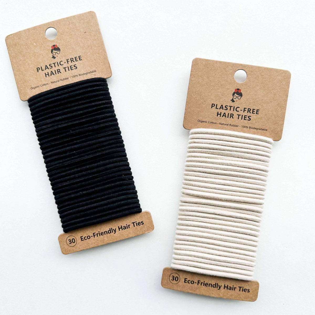 Two packages of plastic-free hair ties, one black and one beige, on a white background.