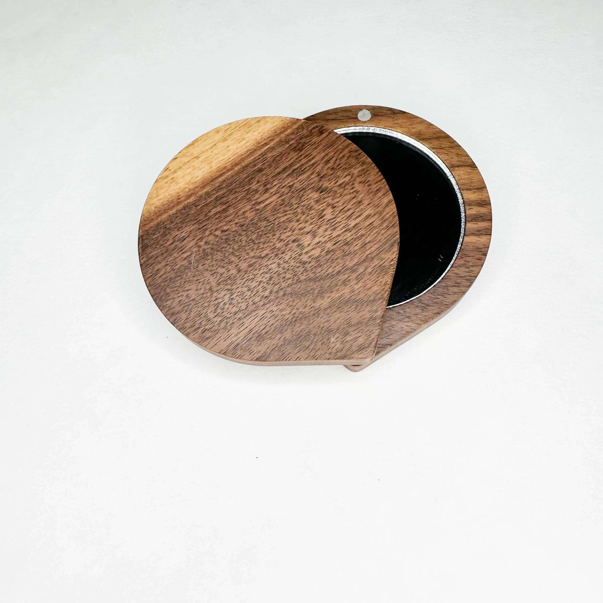 Wooden jewelry box with a mirror on a white background