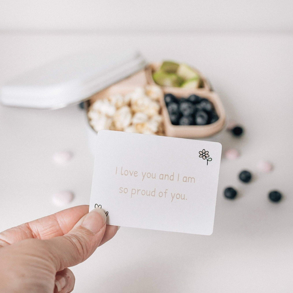 Love Notes - Mindful and Co Kids positive affirmation card with snacks in the background, inspiring confidence.