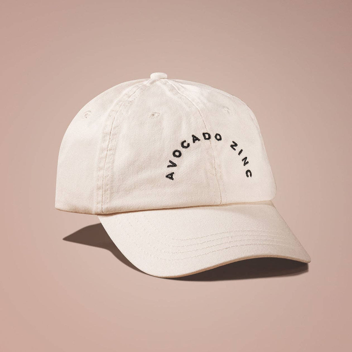 Pre-Washed Canvas Cap in oat shade with adjustable metal clasp and embroidered text, perfect for sun protection.