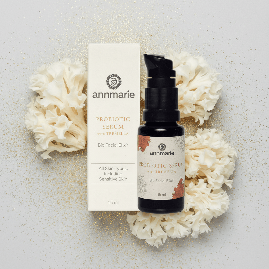 Annmarie Probiotic Serum with packaging on a textured surface with white flowers.
