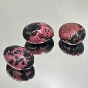 Rhodonite Crystal Palm stones, hand carved and polished, perfect for meditation and energy work.