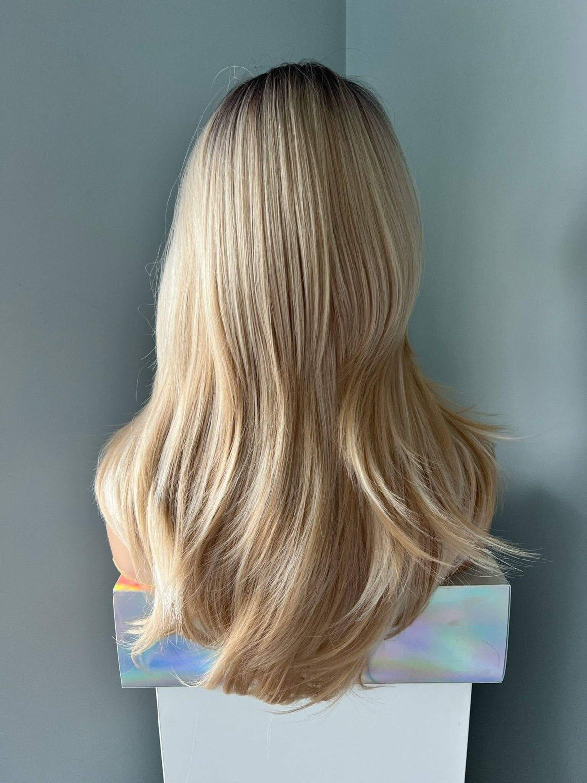 Back view of Rylee Mixed Blonde Wig with Layers, showcasing soft, natural-looking layers and shine.