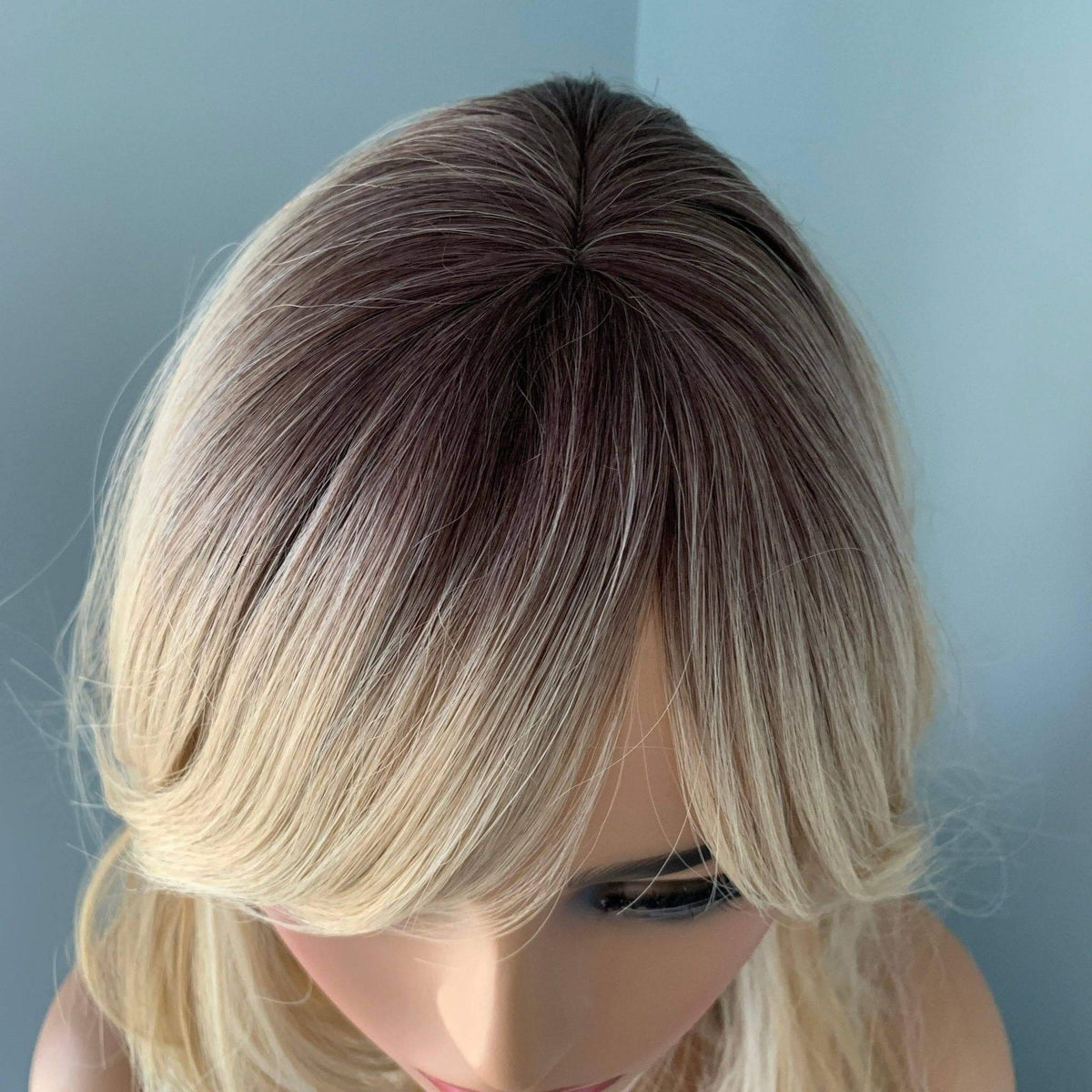 Rylee Mixed Blonde Wig with Layers featuring soft natural-looking layers and bangs.