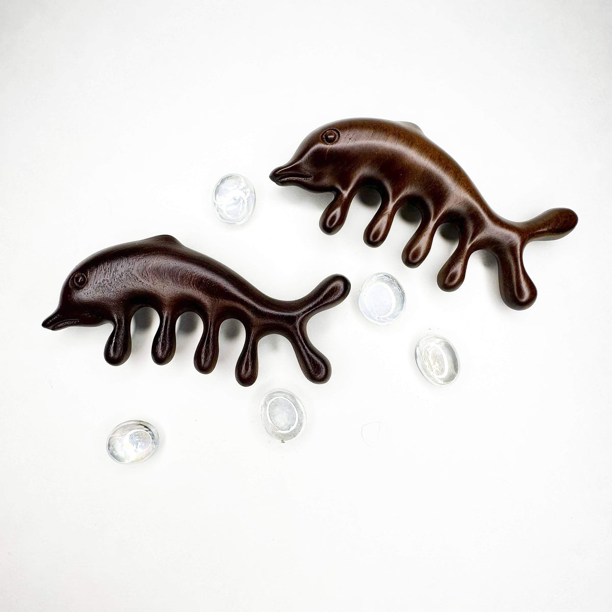 Two chocolate hedgehog-shaped candies on a white background
