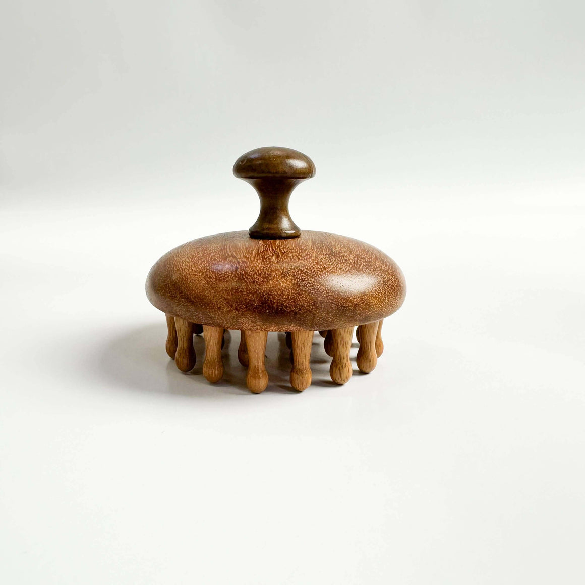 Wooden scrubber with a handle on a white background