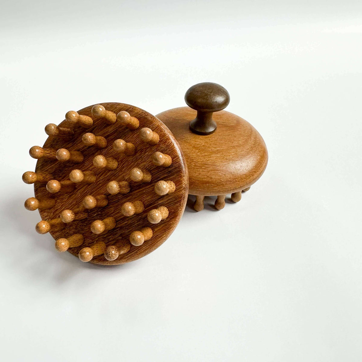 Wooden hairbrush with bristles on a white background